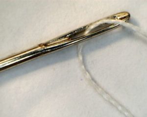 a_needle_with_thread